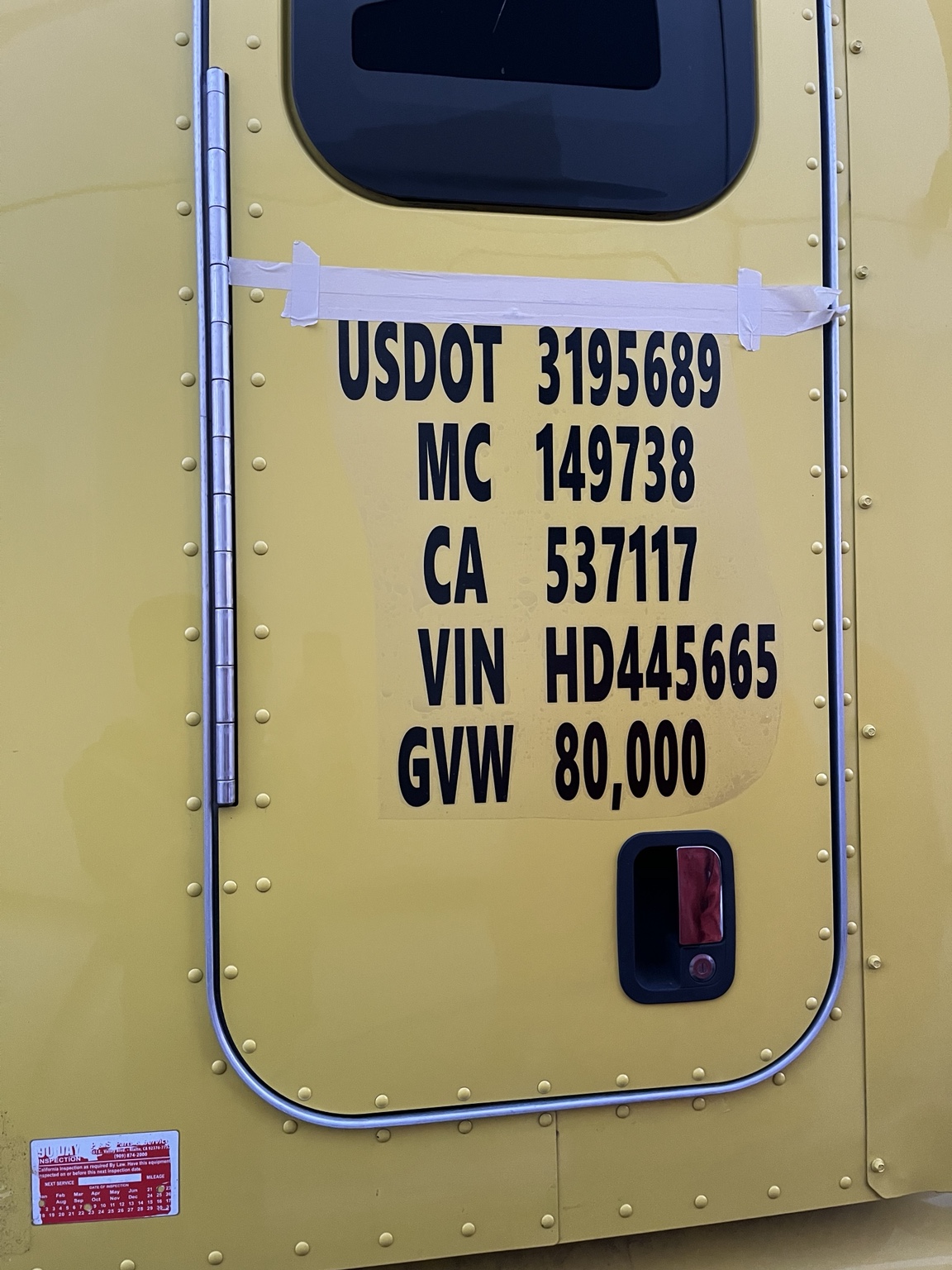 Regulation decals on yellow truck